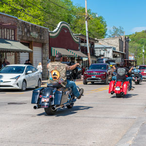 Motorcyclists riding in formation on a busy urban road - Mullins & Blake Attorneys