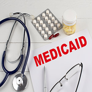 Medical bills, Medicaid, and pills for a rideshare passenger injury claim in Arkansas.